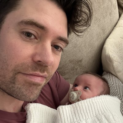 Max, founder of ParentPA, with his newborn baby